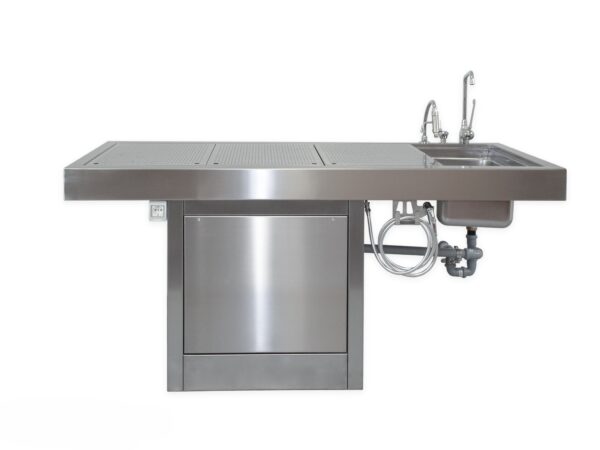 Vista frontal de la mesa de autopsia 6ATP299 con pedestal central y superficie ventilada en acero inoxidable AISI 304